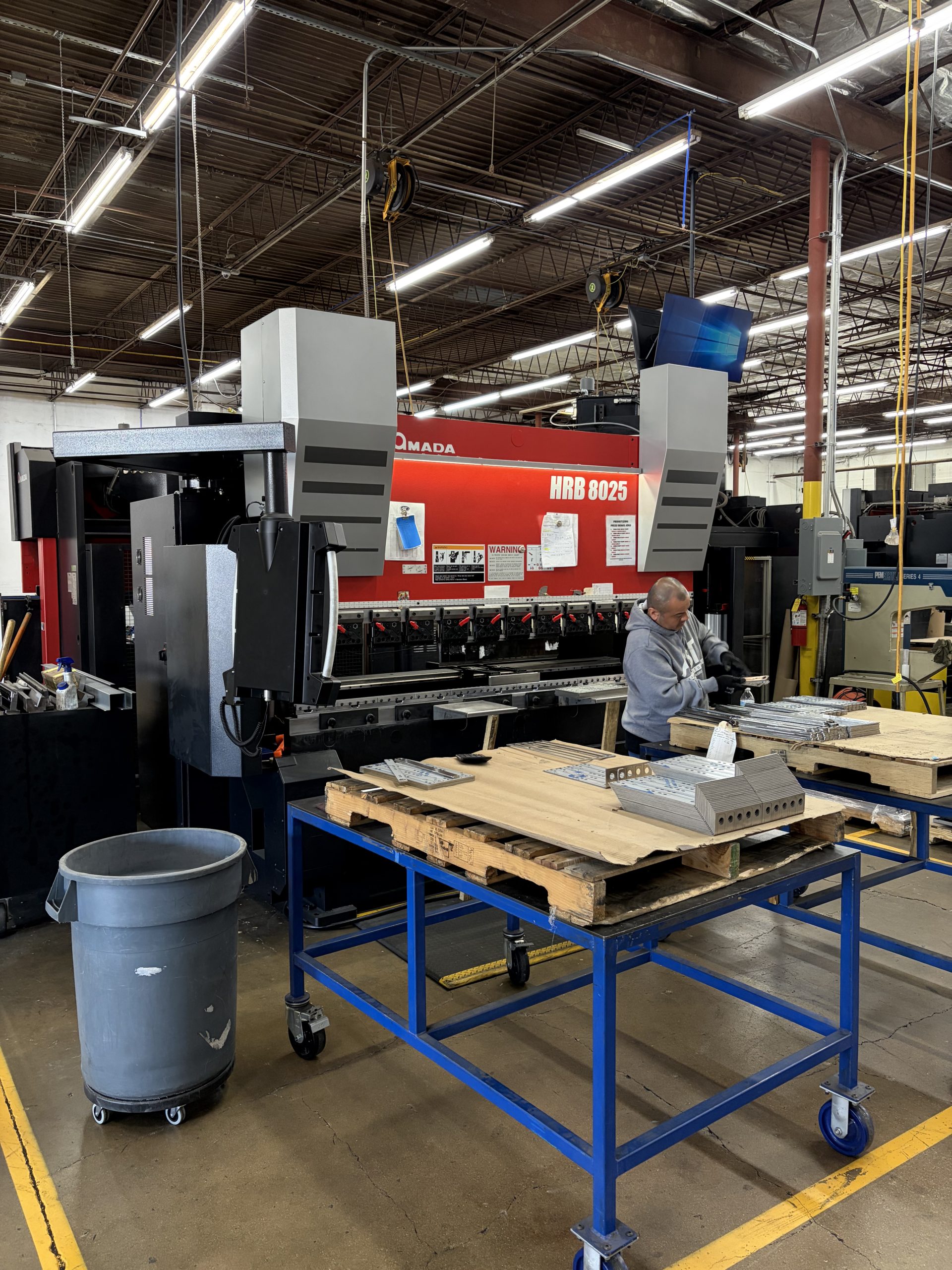 AST Manufacturing operator working at new Amada press brake
